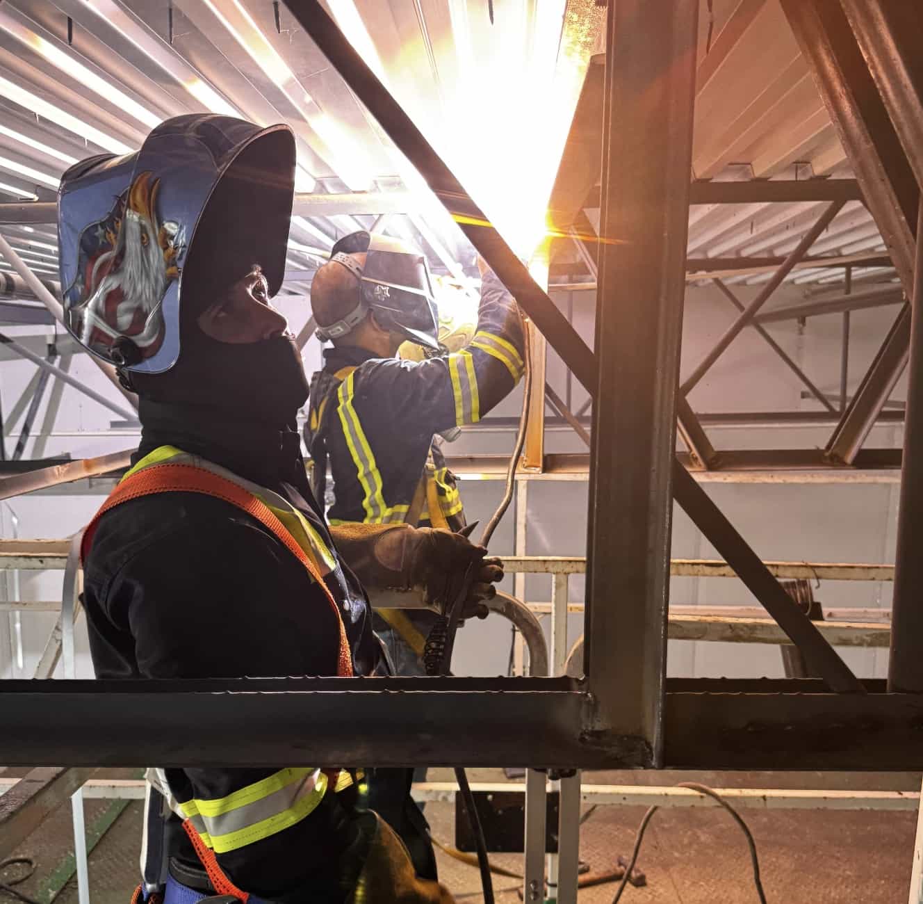 Yoiris Amado and a fellow welder working a structural steel connection on a Tampa Bay job site